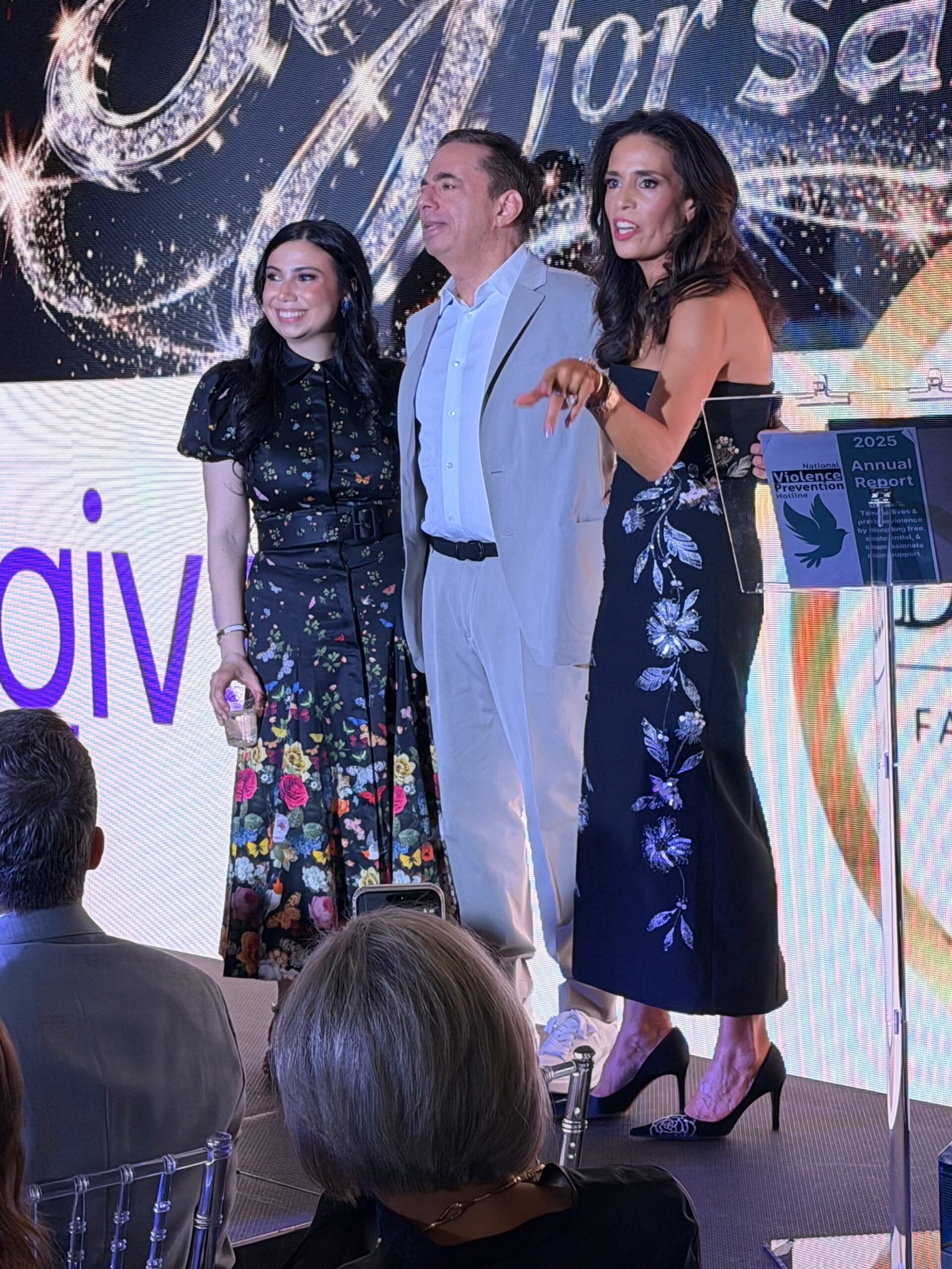 Gabrielle Diecidue and event leaders on stage at the Style for Safety Violence Prevention Hotline event promoting community-based violence prevention and crisis intervention awareness