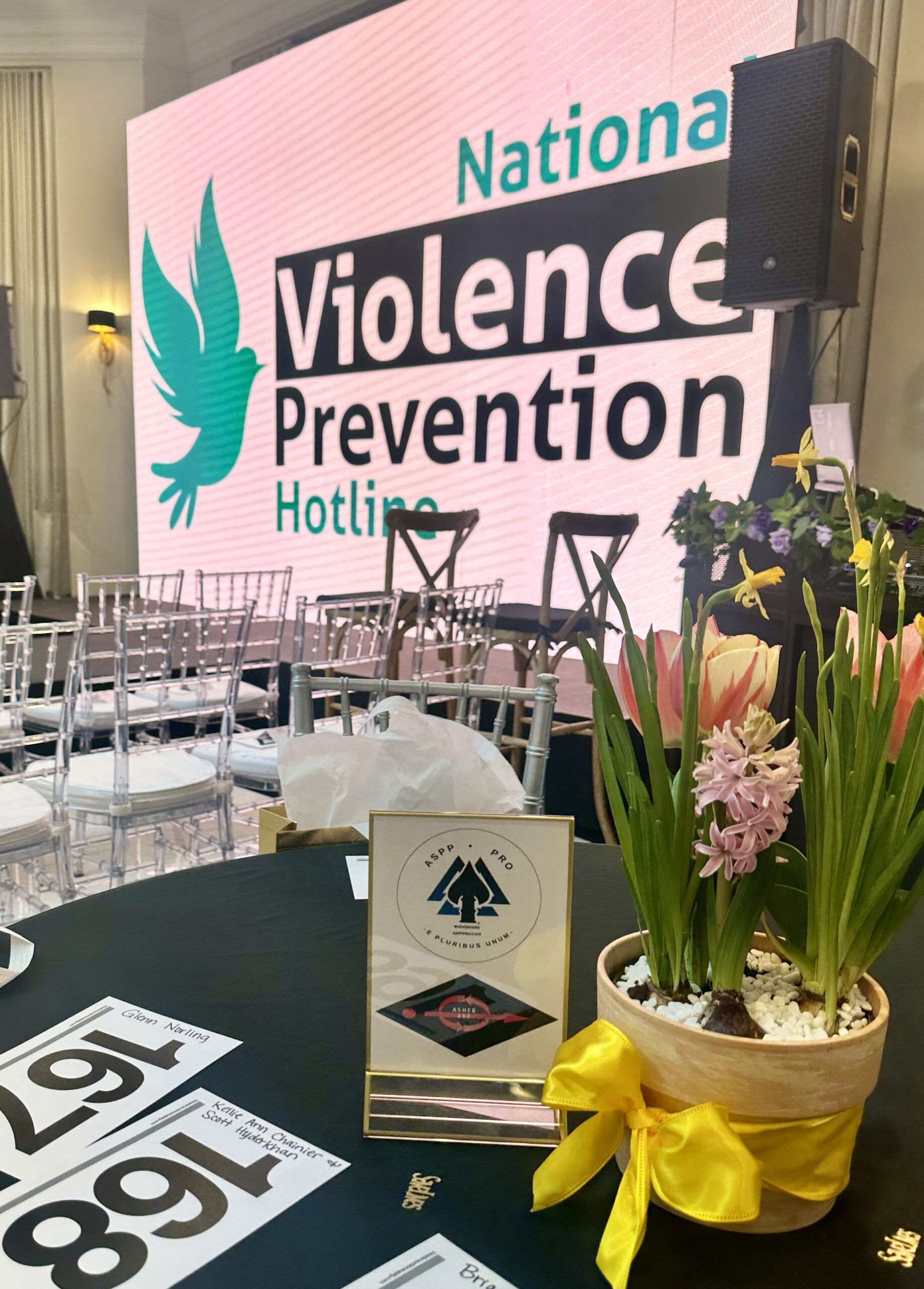 Violence Prevention Hotline event stage with Active Shooter Prevention Project™ table display and prevention leadership gathering supporting crisis intervention and community safety Violence Prevention Starts Here