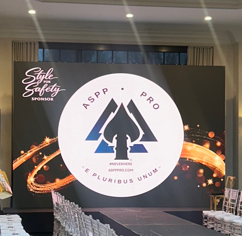 Active Shooter Prevention Project™ stage display at Style for Safety violence prevention event supporting the Violence Prevention Hotline and community safety initiatives