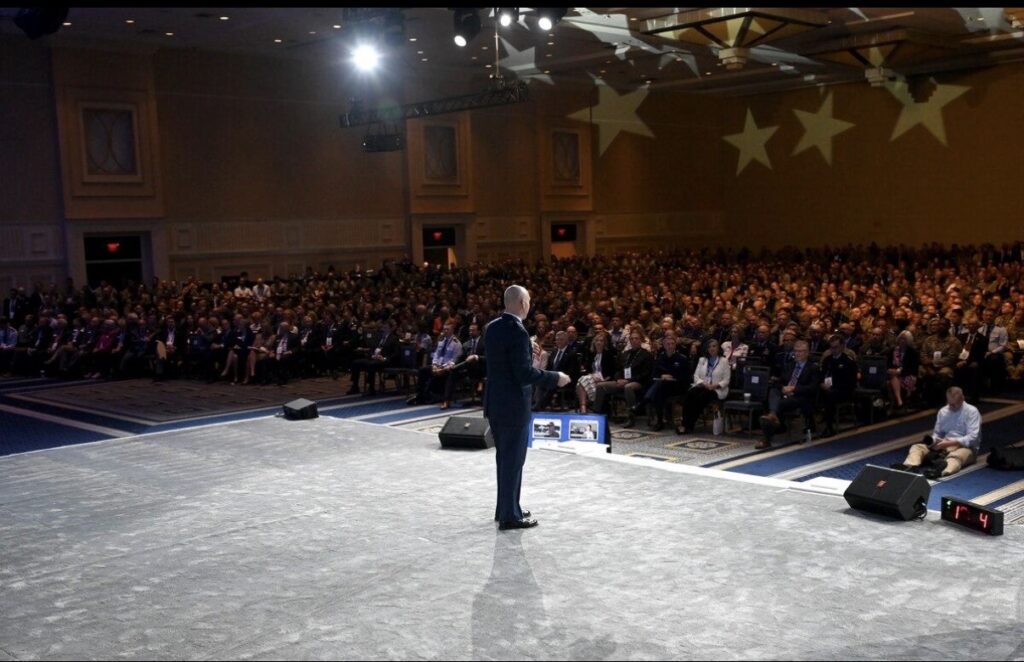 Chris Grollnek delivering an active shooter prevention keynote address to a packed national conference audience, demonstrating the nationwide reach of the ASPP PRO Model™ program