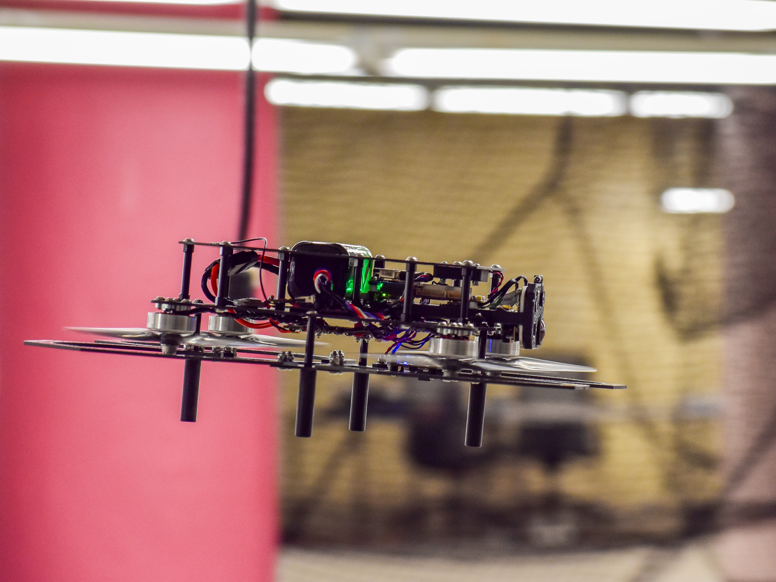 Brecourt indoor drone first responder hovering inside a facility, equipped with onboard camera and sensors